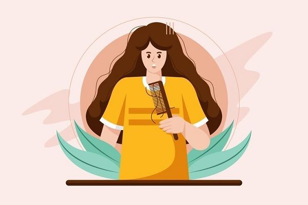 Fases del crecimiento del pelo - Imagen representativa de una mujer cepillando su cabello, observando que se desprenden más hebras de lo habitual debido al efluvio telógeno